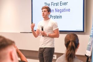 Photo of Friends and Family Demo Day, founder pitching