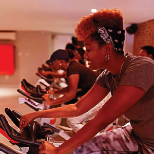 group of black women on exercise bikes at Harlem Cycle