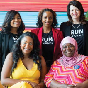 five women wearing vote run lead t shirts