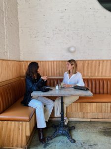 Two women drinking coffee