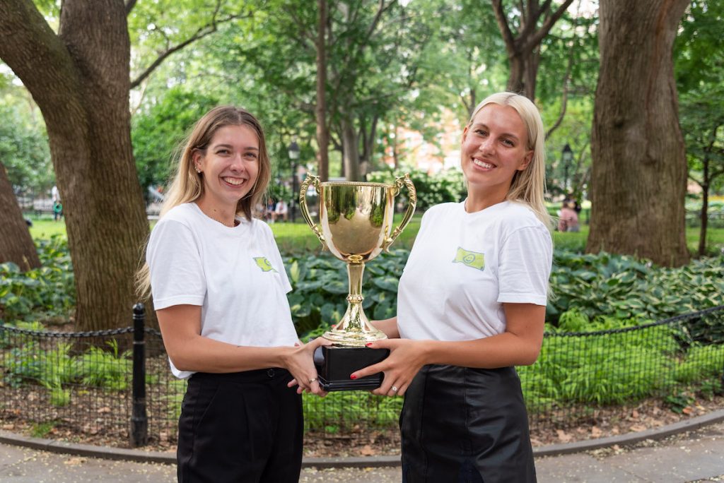 Photo of Frich founders holding the trophy