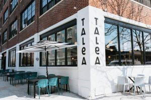 photo of Talea brewery outside, big windows and chairs
